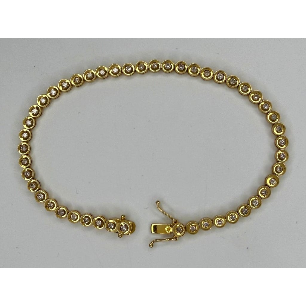 18K Gold Diamond Tennis Bracelet on white background