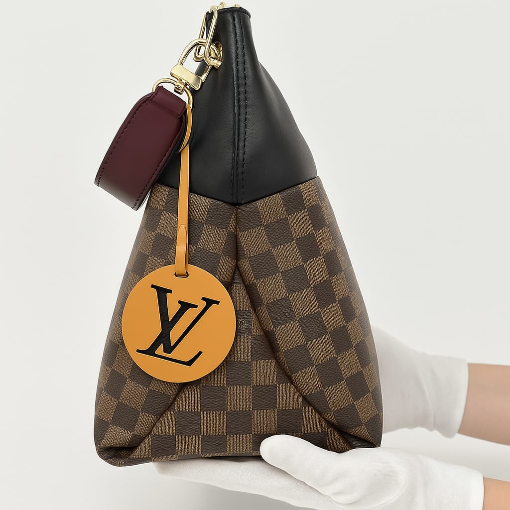 Close-up of Louis Vuitton Maida handbag gold hardware