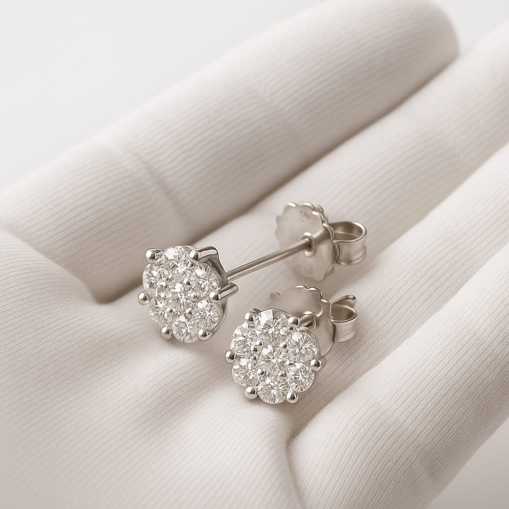 Detail of 14K White Gold Diamond Cluster Earrings held by a white glove