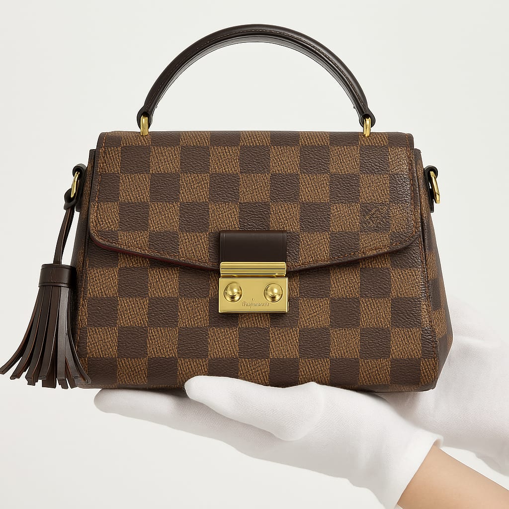 Close-up of Louis Vuitton Croisette's gold hardware