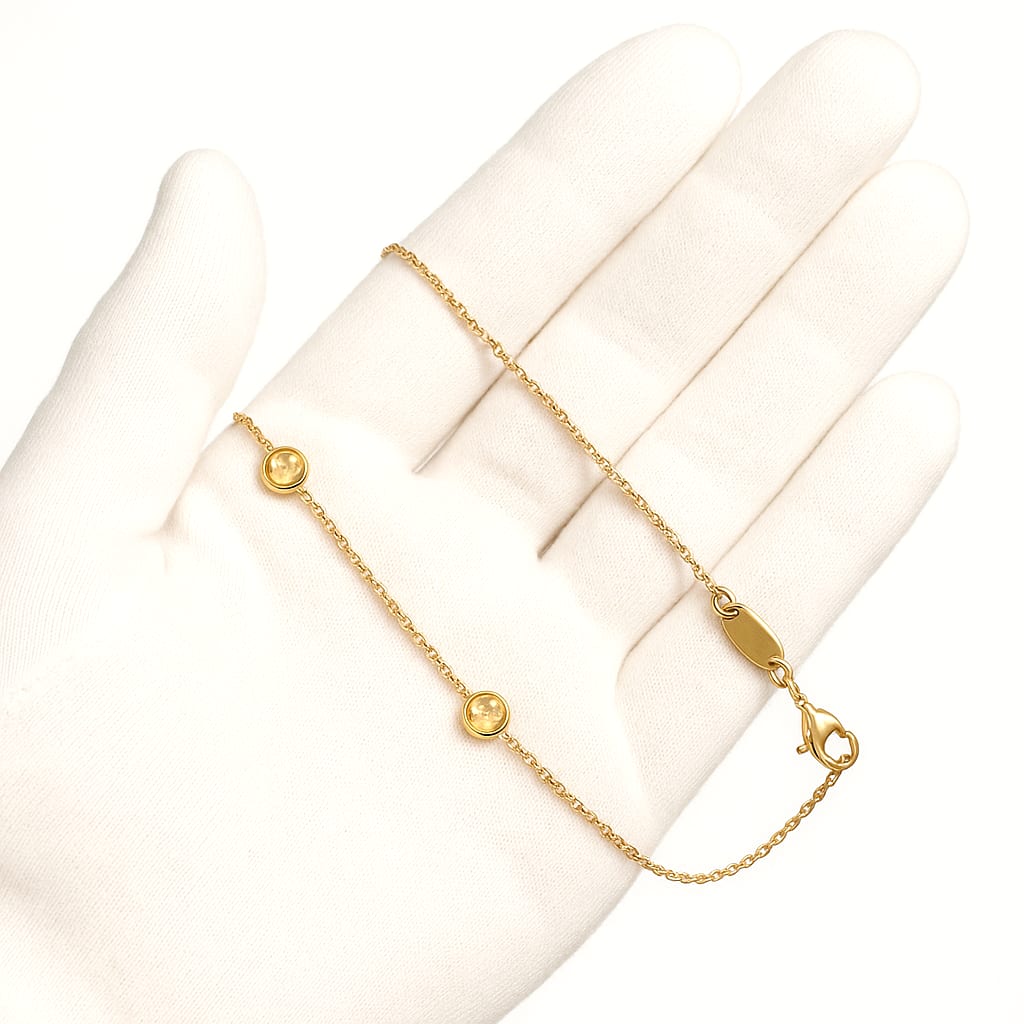 Detailed view of the necklace held by a gloved hand