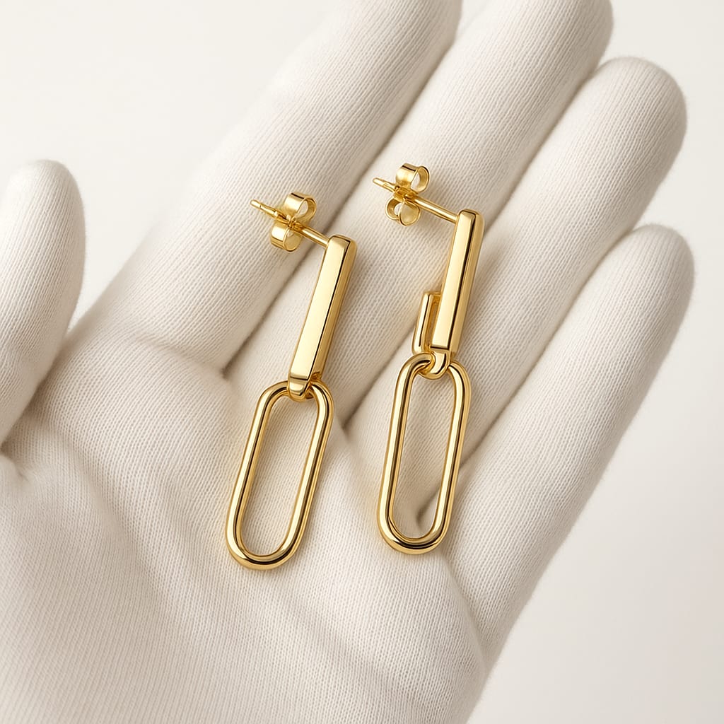 Detail of 14K Gold Paperclip Earrings Held with White Glove