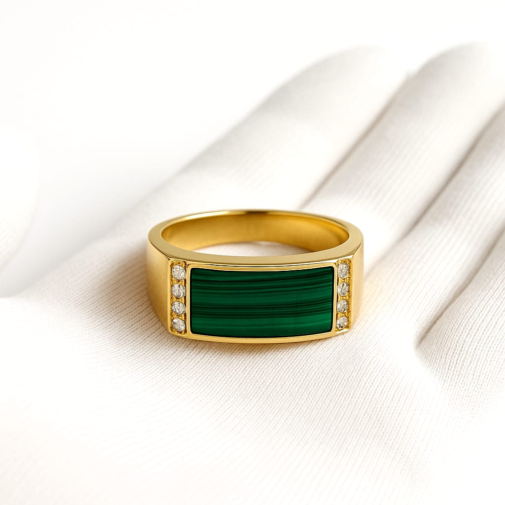 Detail of the ring held by a white-gloved hand