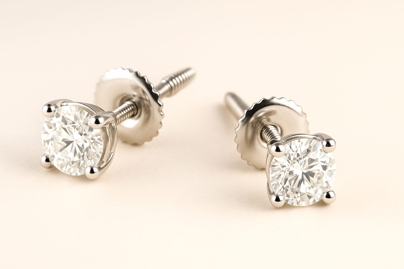Diamond stud earrings displayed in luxury box