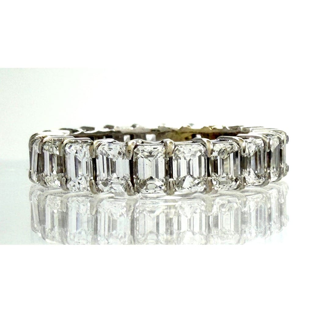 Close-up of emerald cut diamonds on the eternity band