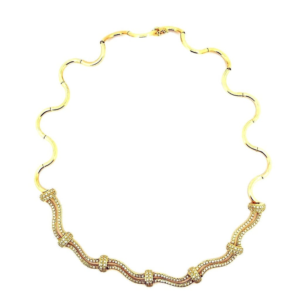 Close-up of 18K Yellow Gold Diamond Necklace with Swirl Design