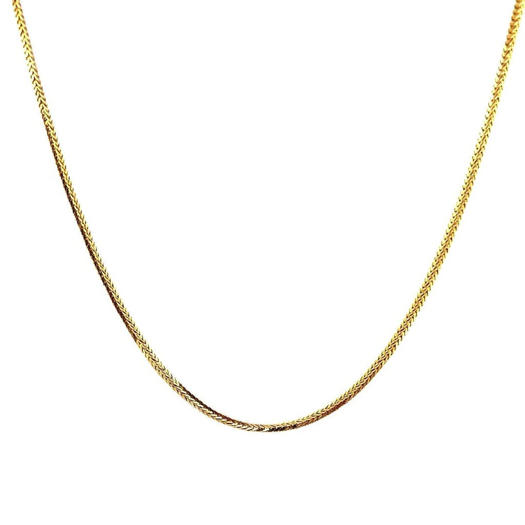 Close-up view of the 16K yellow gold wheat chain
