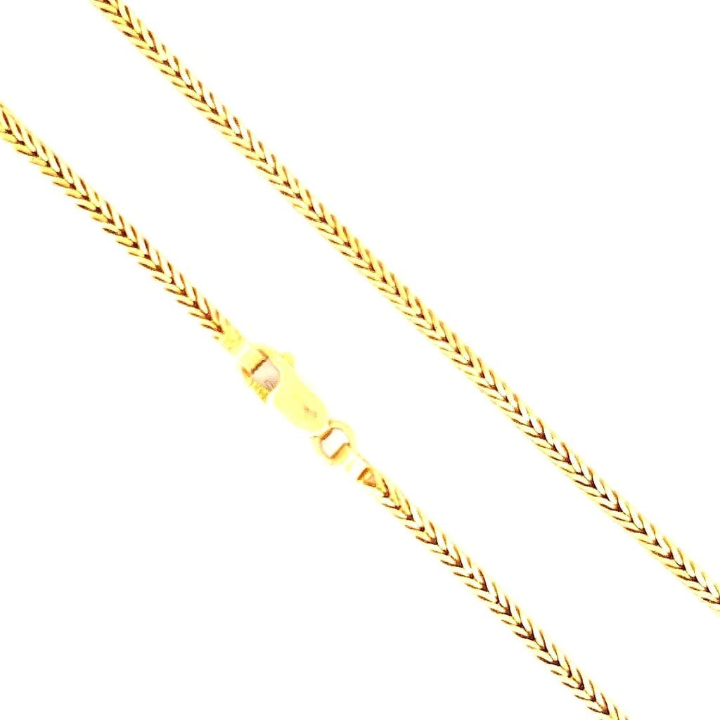 16K yellow gold wheat chain displayed on a mannequin
