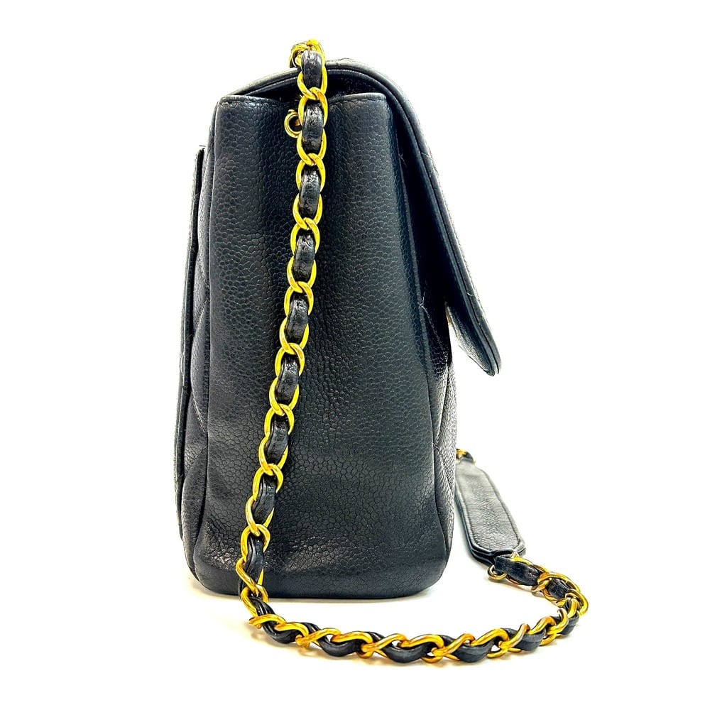 Chanel CC Square Flap Bag showing wear on leather edges