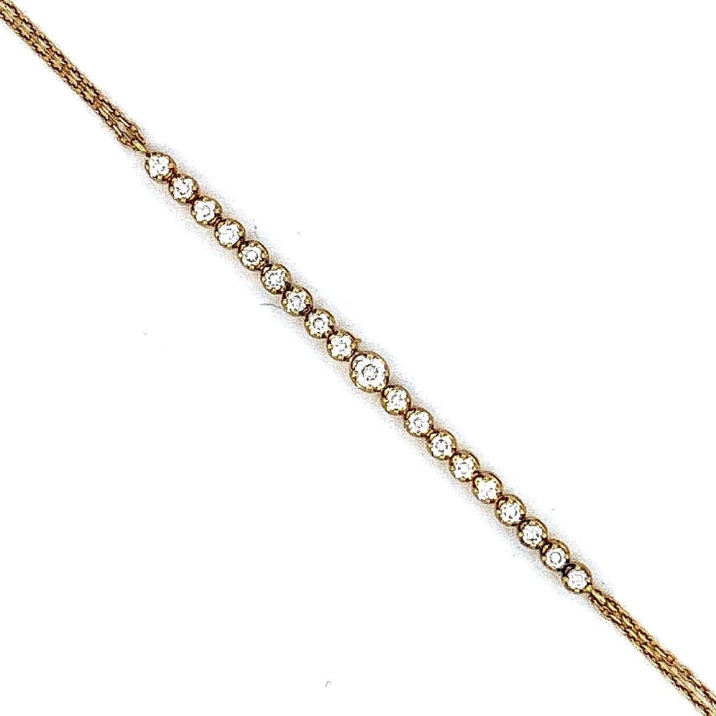 20K Gold Diamond Butterfly Bracelet on display