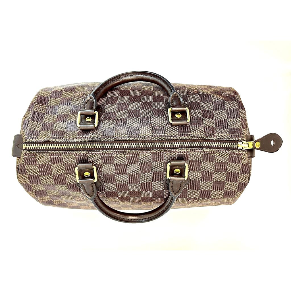 Side view of Louis Vuitton Speedy 30 showcasing gold hardware