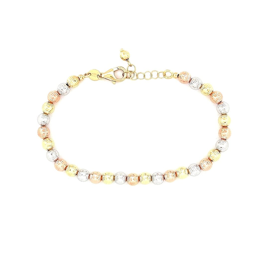 18K tri-tone bead bracelet on display