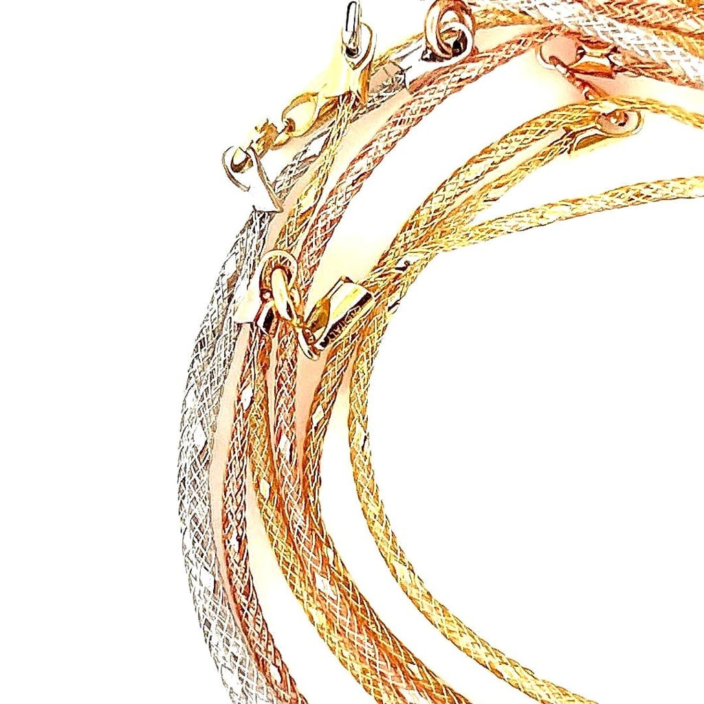 Close-up of mesh design on 18K Tri-Tone Gold Bracelets