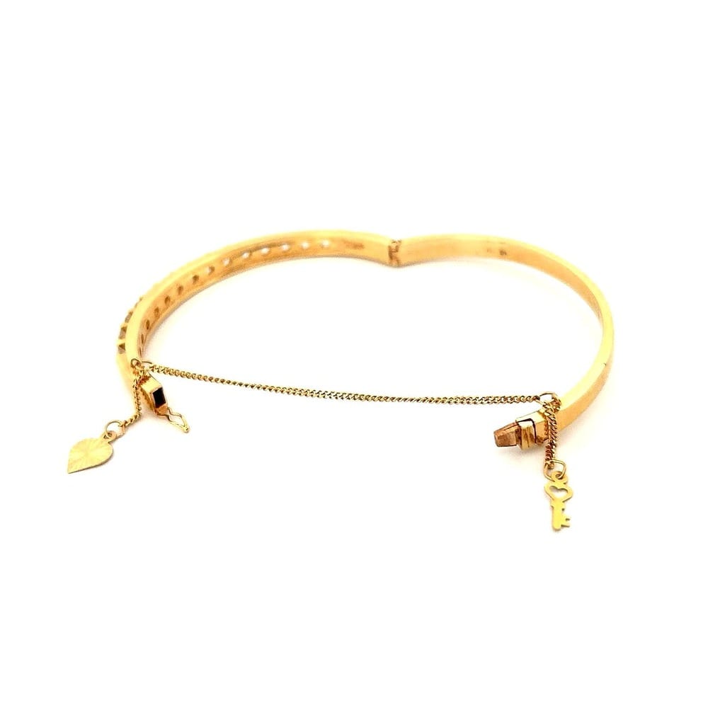 Full view of the 18K Gold Diamond Bangle highlighting its elegant design.