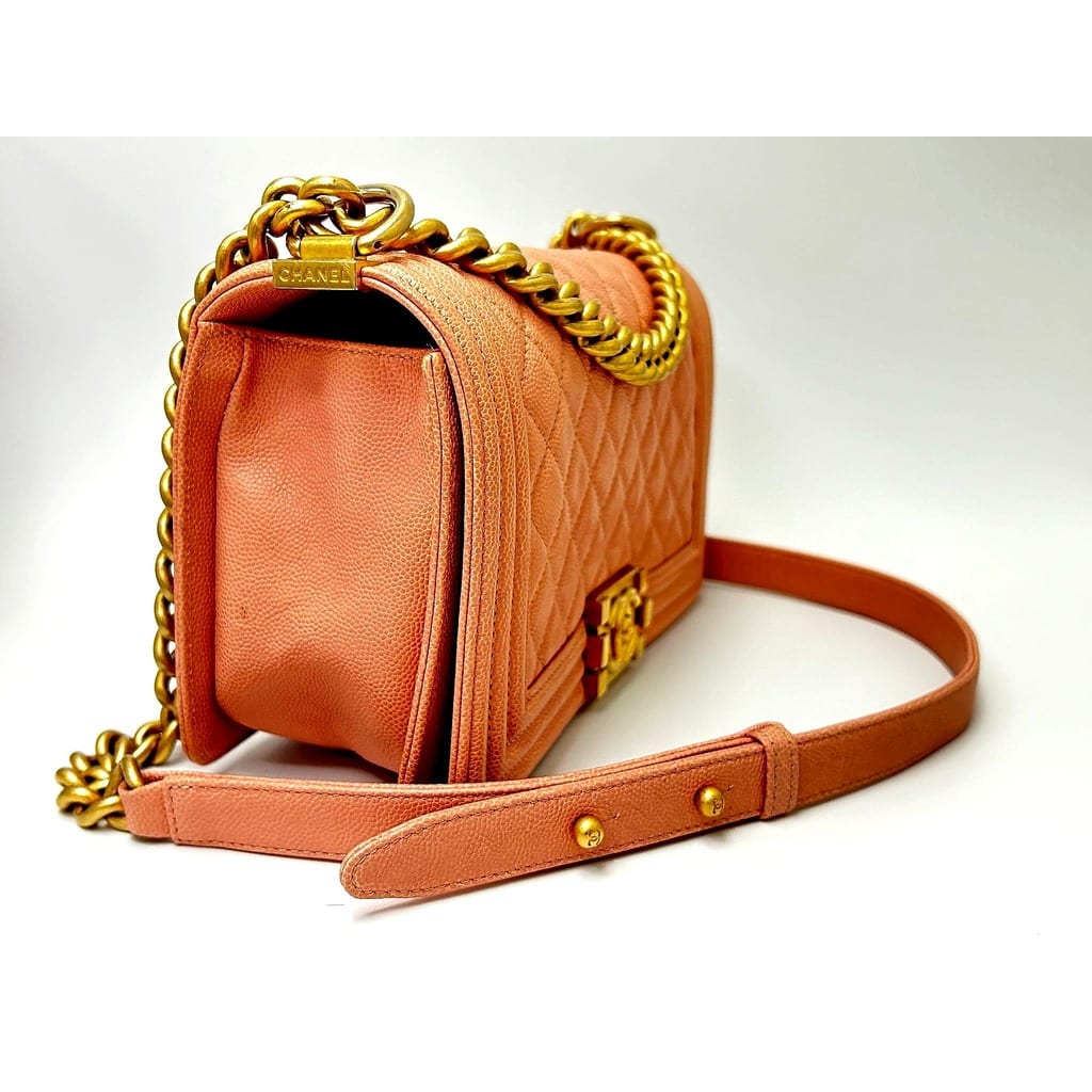 Close-up of the Chanel Boy Bag's gold-tone hardware and CC lock