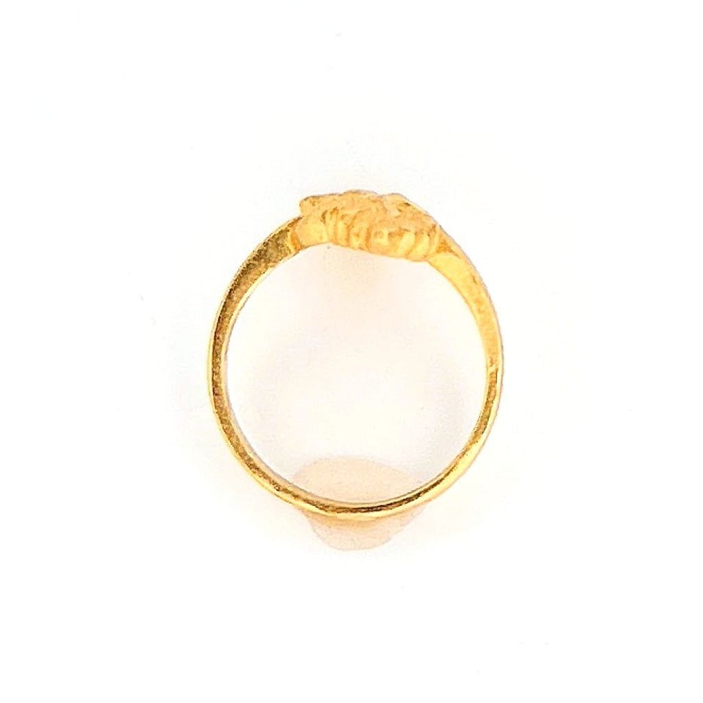 Elegant gold ring on a display stand