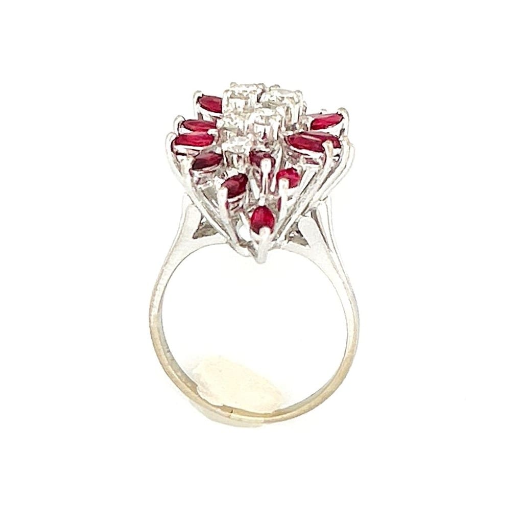 Side view of the ring showing the prong setting and gemstone arrangement.