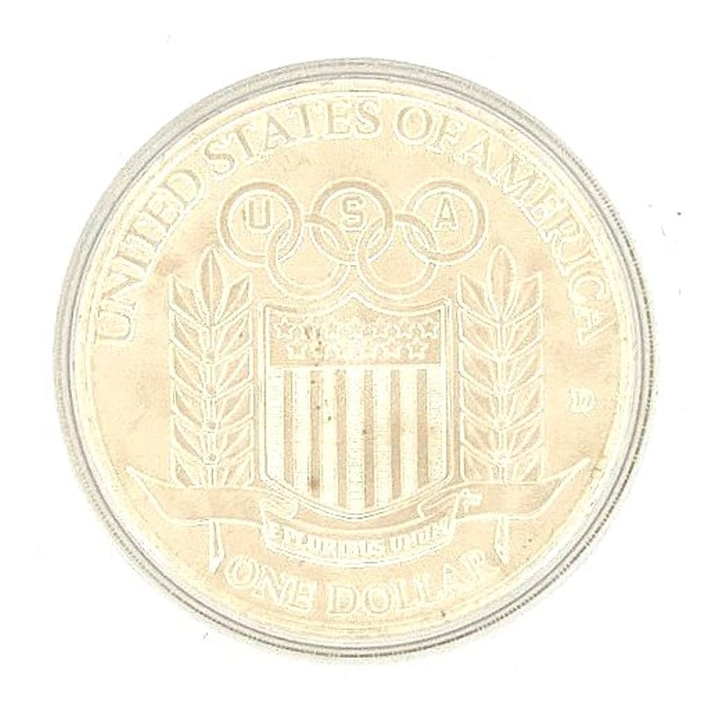 Close-up of the Olympic rings and athlete design on the coin