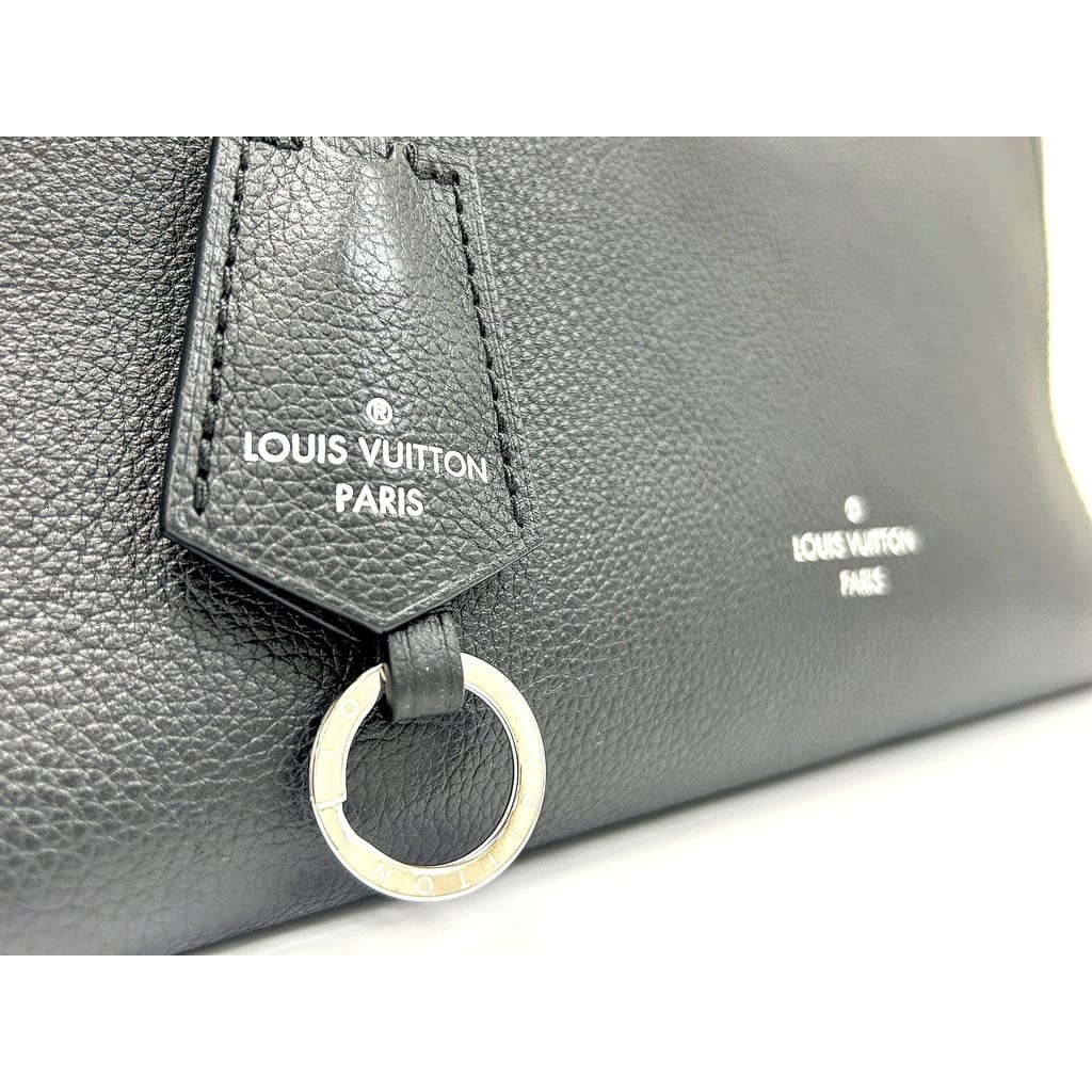 Side view of the Louis Vuitton LockMe Cabas MM Black Tote